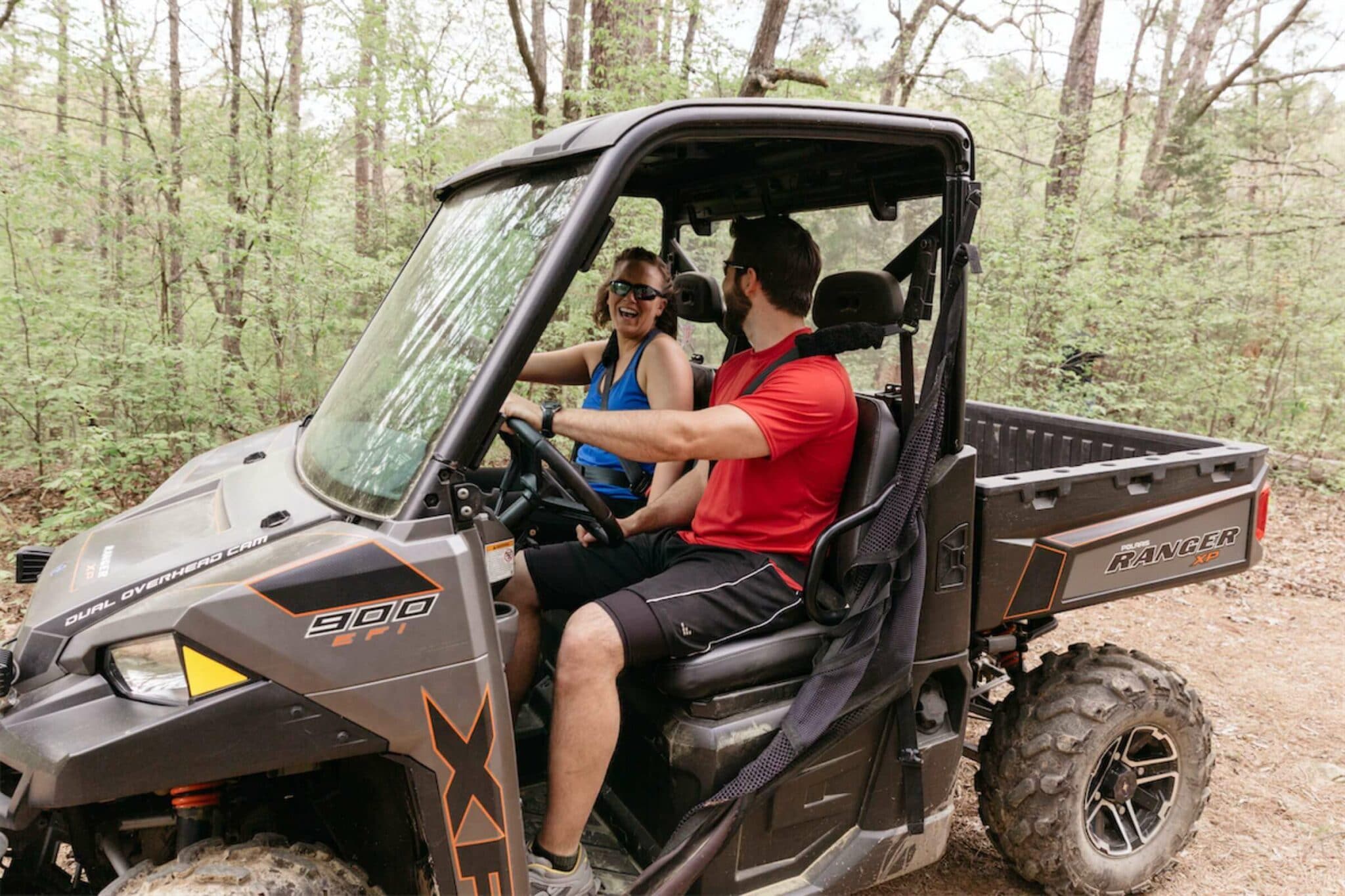 A couple riding in a UTV at FFB.