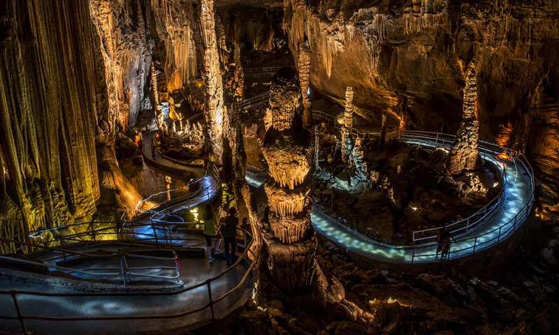 The interior of the Blanchard Springs Caverns with lots of stalactites and stalagmites.