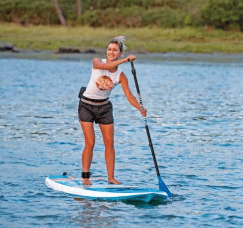 A woman paddleboards on Greers Ferry Lake.